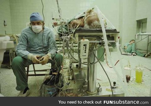 Heart surgeon and his assistant after 23 hour surgery