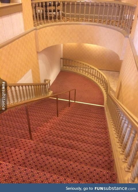 This fancy staircase leads directly into a wall