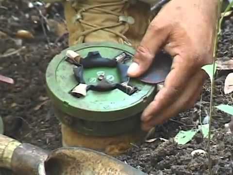 Cambodian man shows how to disarm a landmine