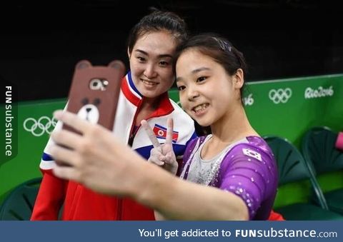 Gymnasts from North & South Korea take a selfie together. This is why we do the olympics