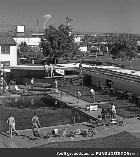 People in Vegas watch a mushroom cloud rise in 1953