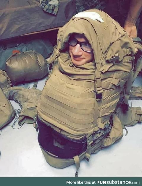 U.S Marine stuffed into a backpack