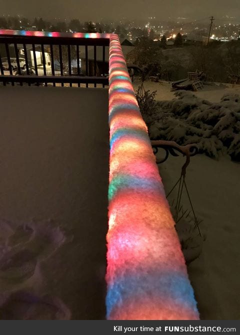 Fresh snow over Christmas lights