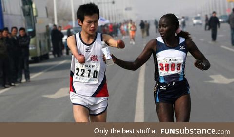 Jacqueline kiplimo helps a disabled runner finish a marathon in taiwan