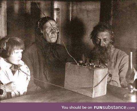 A family listens to an evening broadcast, Soviet Union 1928