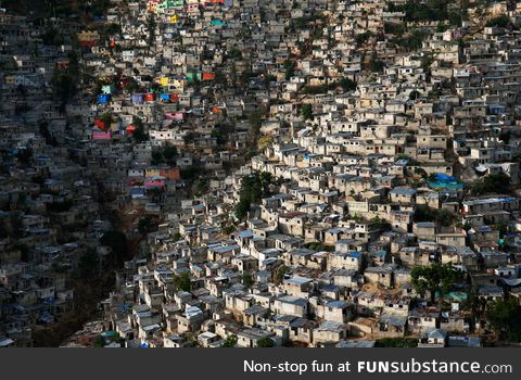 Large shanty town built onto a hillside in Haiti