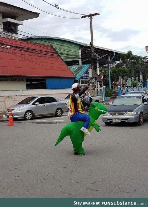 Thai police officer having fun on the job