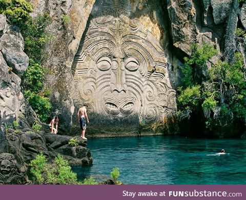 Maori rock carvings at Mine Bay, New Zealand