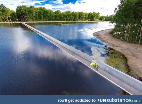 Bike path going through a lake in Limburg, Belgium