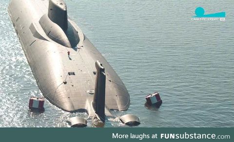 Soviet Typhoon Class, the biggest submarine ever made (there's a man on the deck)