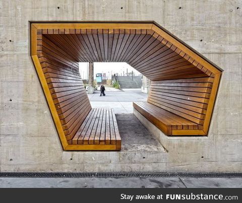 Wooden bench built into a concrete wall