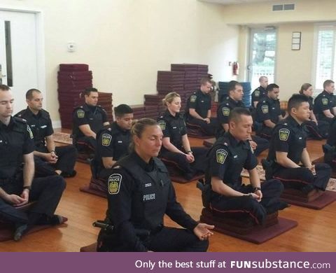 Canadian police officers meditating before they start their day