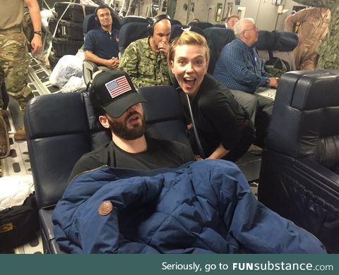 Scarlett Johansson and a sleeping Chris Evans on a USO tour