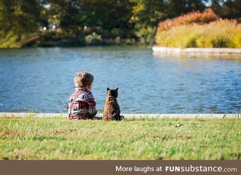 This child has loved this cat since the day he was born.