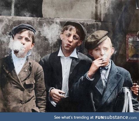 Paperboys on smoke break, circa 1910