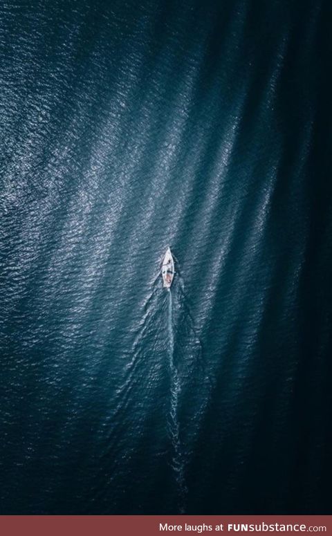 This rip in a leather sofa looks like a boat floating in the open sea