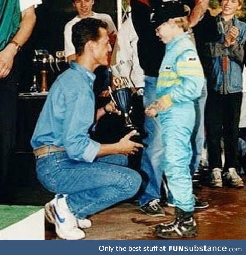 Michael Schumacher gives trophy to little Sebastian Vettel