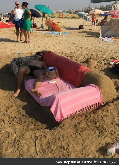 Genius on the beach. Why build sand castle when you can build sand sofas