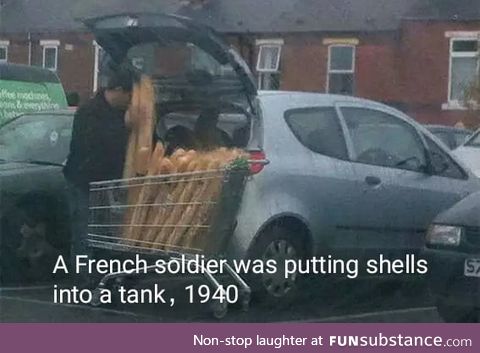 A French soilder was putting shells into a tank. 1940