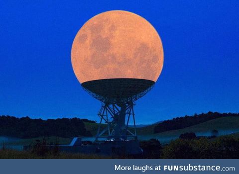 The moon positioned perfectly on top of the satellite