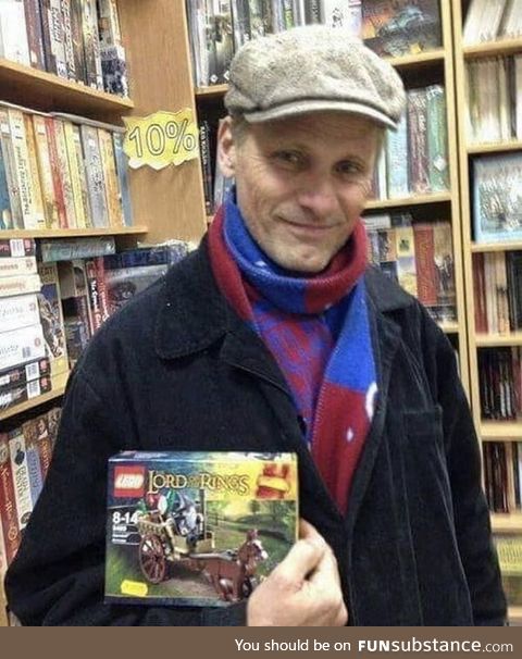 Here's a wonderful picture of Viggo in a bookstore holding a Lego set