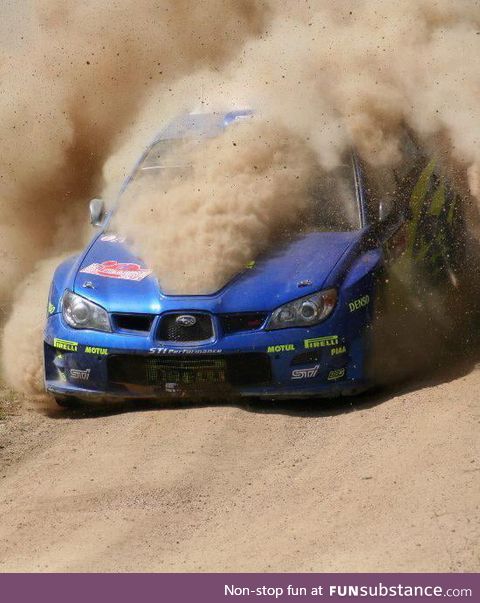 This shot of a WRC Subaru Impreza rally car