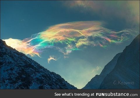 Iridescent clouds look like soap bubbles. Belukha mountain, siberia