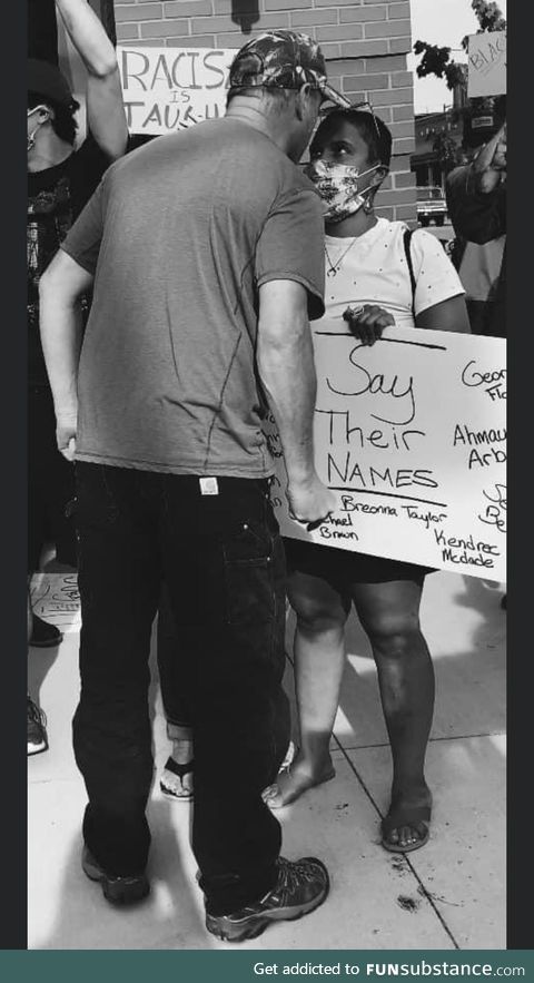 Woman stands strong in the face of hate during a BLM protest