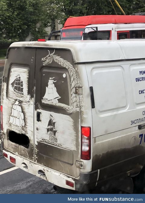 Drawn in the dirt, on the back of a van in Russia