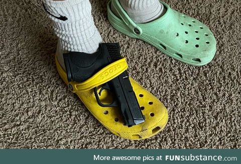 You've heard of elf on the shelf, now get ready for Glock on a croc