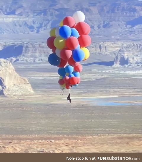 David Blaine nonchalantly floating over Arizona holding 52 helium balloons