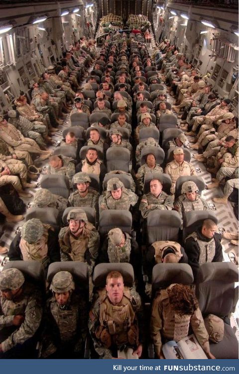 Soldiers Coming Home From War. Rare view inside a military transport