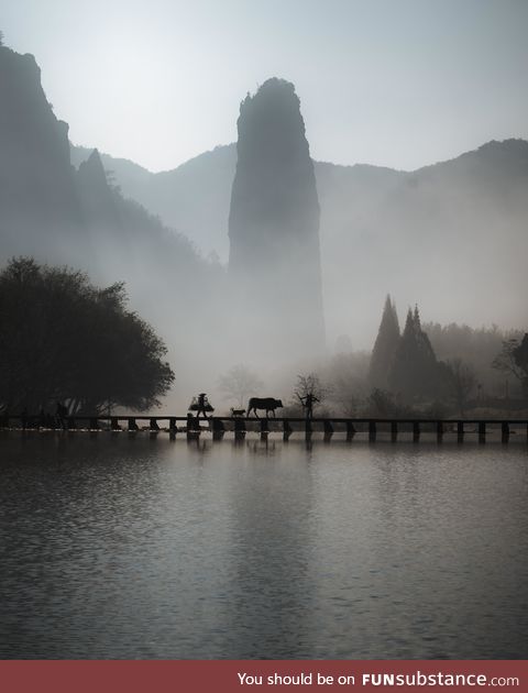 Chinese Farmers Crossing a Bridge