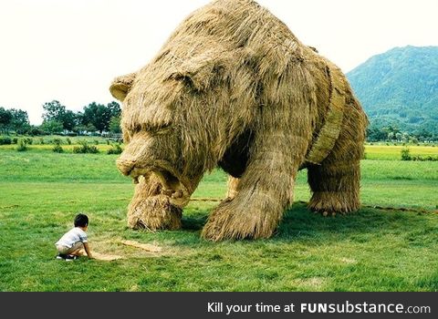 Bear sculpture made from leftover rice straw in Japan