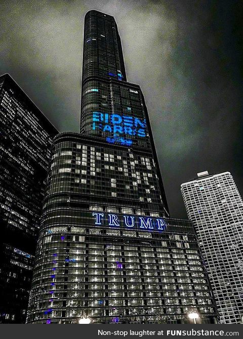 The Biden Harris logo projected on the side of Trump Tower in Chicago