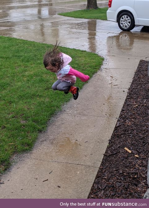 Sometimes little girls just need to jump in puddles