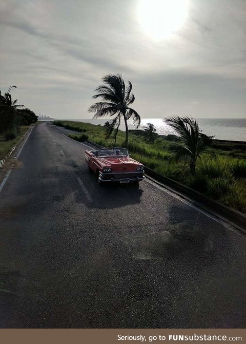 Cell Phone, tinted bus window, amazing shot. Havanna Cuba