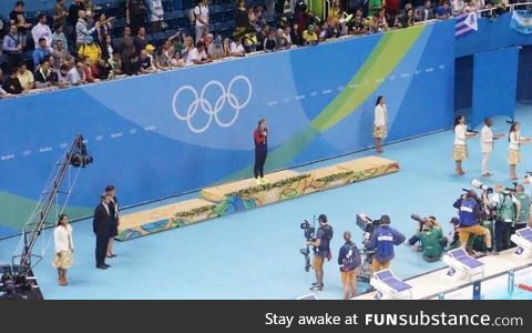 Katie Ledecky at her medal ceremony . . . Waiting for her opponents to finish the race