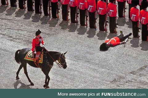 Queen Elizabeth II personally executes a soldier for "not standing precisely in line