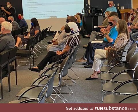 Woman at local anti-mask meeting wore a space helmet