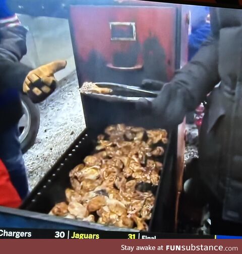 Watching Bills fans cooking meat… in a filing cabinet