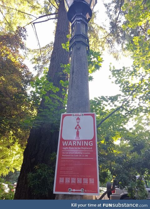 The sign on this pole says “Do Not Attach Anything To Poles.”