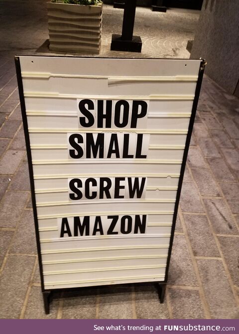 Sign near Diament Jewelry at The Wharf in Washington, DC: Shop small. Screw Amazon