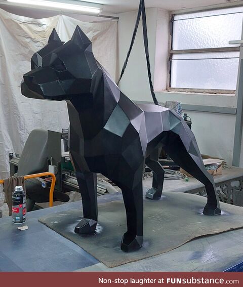 Pitbull sculpture made out of stainless steel