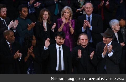 Brandon Tsay, the man who disarmed the Calif., gunman, sits near Bono and Dr. Jill Biden