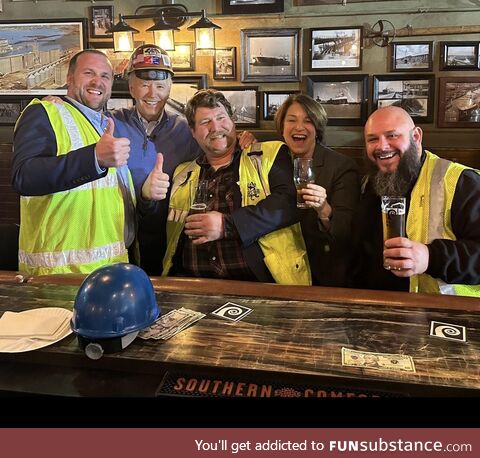 President Biden with union workers and his hard hat backwards