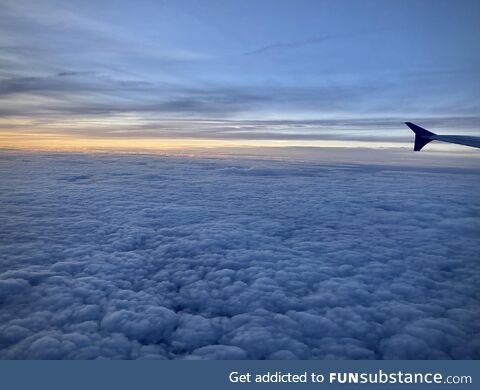 Sunset over a field of clouds