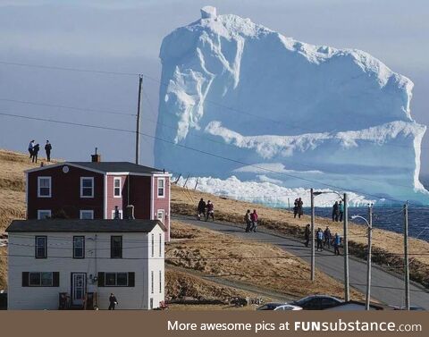 A 150-Foot Iceberg Drifts Past a Canadian Home