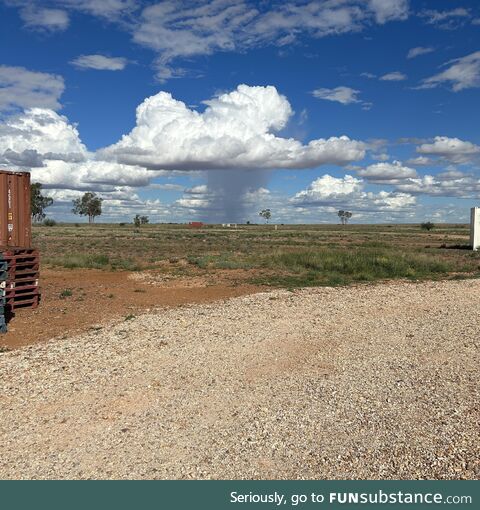 Cloud burst over the desert. Queensland, Australia