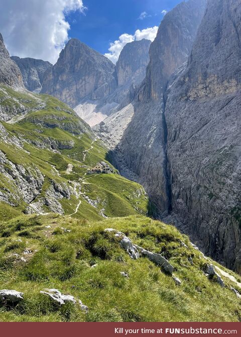 Rifugio Bergamo nestled between the peaks of the Dolomites in Sciliar Rosengarten Nature